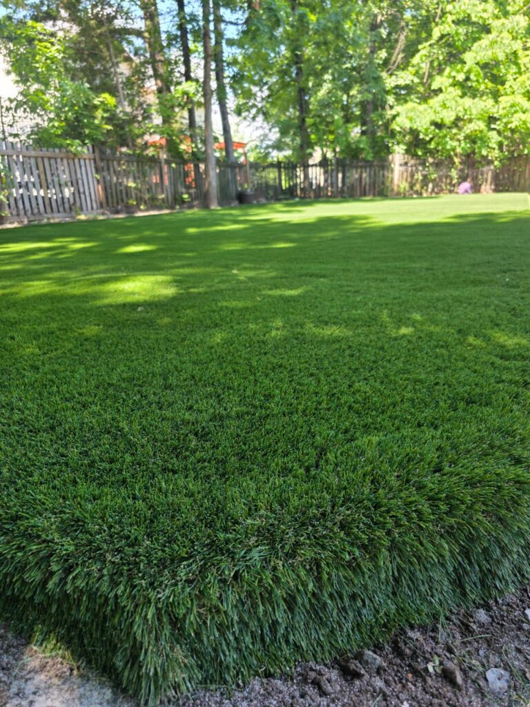 Artificial grass installed across a large residential backyard